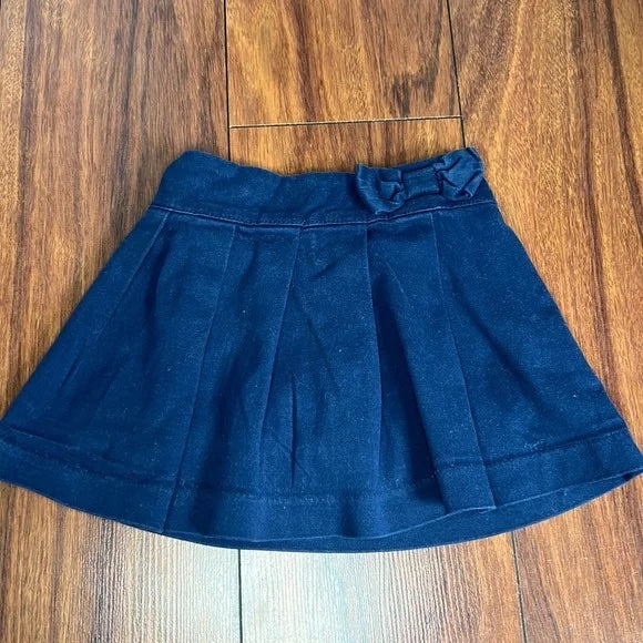 The Children’s Place Navy Blue Skirt with Shorts attached.