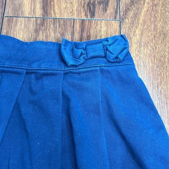 The Children’s Place Navy Blue Skirt with Shorts attached.