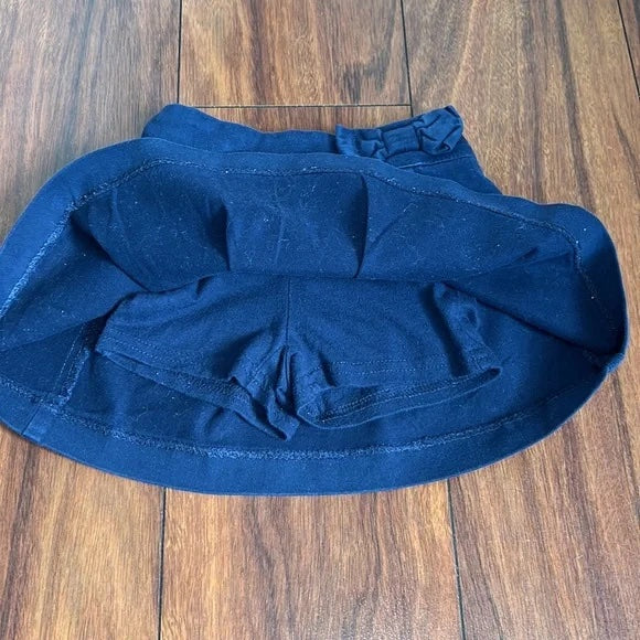 The Children’s Place Navy Blue Skirt with Shorts attached.